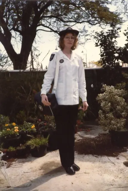A woman in a classic ambulance uniform